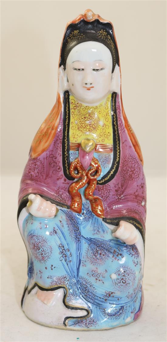 A Chinese famille rose enamelled porcelain seated figure of Guanyin, Jiaqing period, 21cm